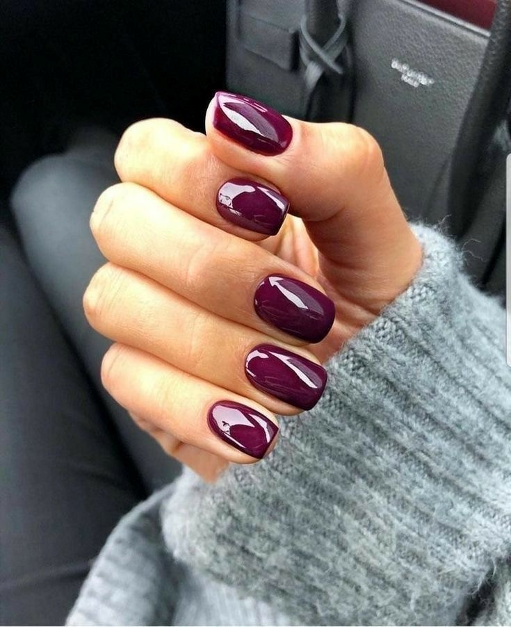 Deep plum glossy manicure with soft square tips at Coastal Polish & Beauty